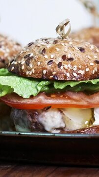 Fresh burgers on the plate - commercial kitchen