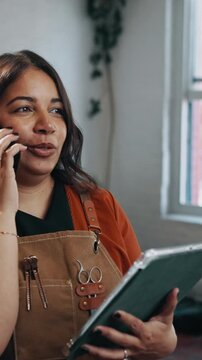 Stylist, tablet or woman with phone call for appointment, schedule or online booking in beauty salon. Female person, barber or talking with smartphone or technology for grooming session in barbershop