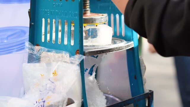 Street Vendor Using Manual Shaved Ice Machine in Bangkok