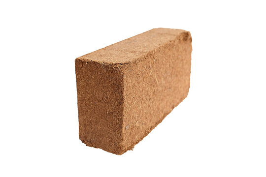 Compressed coconut coir brick for gardening, showcasing natural fibers and rectangular shape, suitable for soil amendment and plant growth enhancement