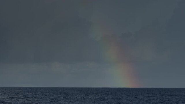Dark Atlantic Ocean and stormy clouds as seen from the moving sailing boat