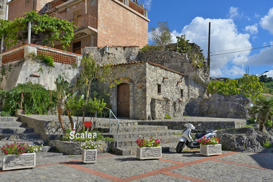 Scalea old town square with historic stone buildings. Calabria, Italy. Historic stone buildings and steps creating a charming street scene in the Italian town of Scalea