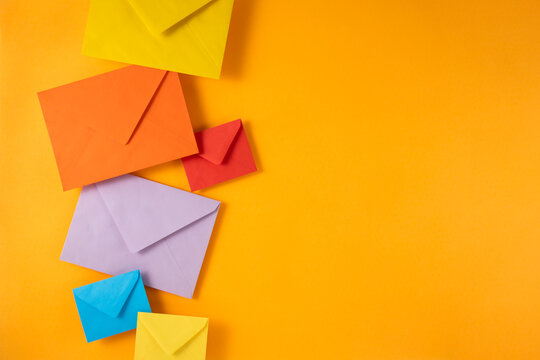 Colorful envelopes on yellow background	