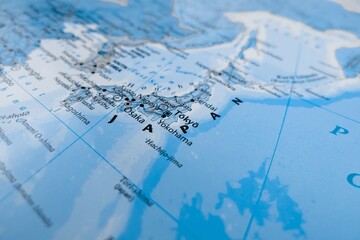 Obraz premium Map of Japan styled in grey color. Selective focus on label, close-up view