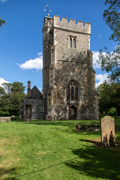 The tower of historic Harlington church, a medieval parish church in Harlington near Heathrow, west London, England
