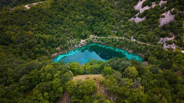Lago Cornino in Italy. Pristine natural reserve around the unique blue mountain lake, scenic aerial