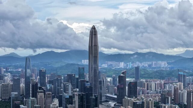 Aerial footage of Ping An Finance Center above cloud sea in Shenzhen
Panoramic drone view of Shenzhen urban skyline and Wutong Mountain
Cityscape aerial shot of Futian CBD skyscrapers surrounded