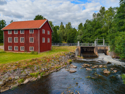 Forsa Mill with historic red mill building and water control dam in V&auml;stra G&ouml;taland, Sweden