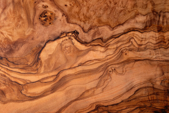 Texture of a wooden board of olive tree using as header or background, natural surface