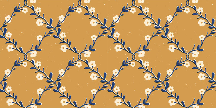 Seamless block print floral pattern with a blue vine lattice on a mustard yellow background