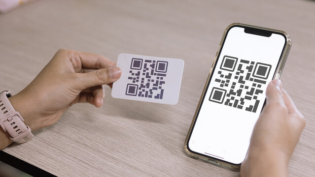 Woman Hands Holding QR Code Card and Smartphone for Digital Payment Concept