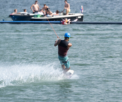 Cable Wakeboarder Riding on Lake in Summer
