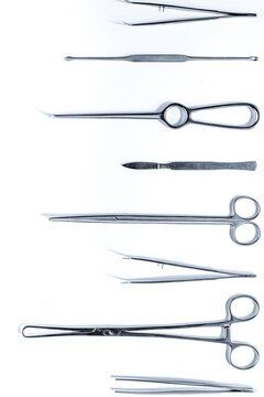 Medical instruments for plastic surgery on white backgrond top view copyspace