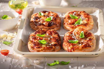 Healthy and tasty pinsa Margherita made of tomatoes and cheese. © shaiith