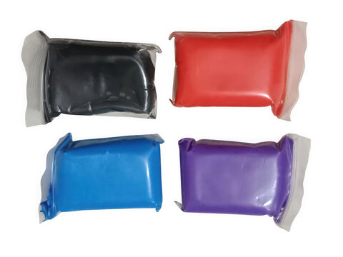 Four colorful packs of modeling clay isolated on transparent background