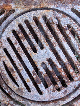 Weathered Rusted Cast Iron Drain Grate Texture