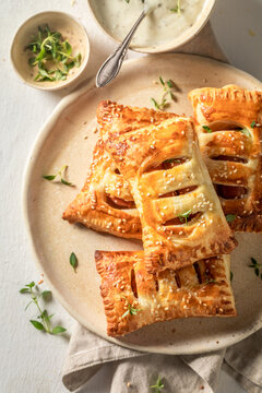 Fresh and delicious sausage roll with thyme and sesame seeds.