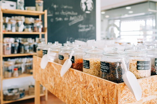 Glass jars with dry food in a zero waste grocery store