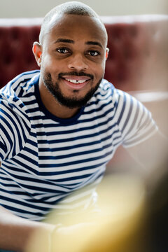Portrait of smiling young man wearing striped t-shirt