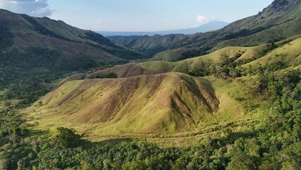 Scenic Rolling Green Hills and Tropical Mountain Valley Landscape in Indonesia © Alsy