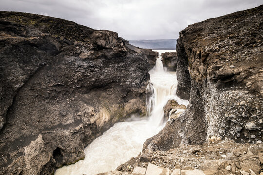 N�ifoss waterfall carves a deep basalt gorge in Iceland