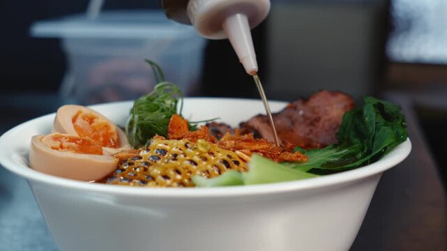 Pouring Sauce over Ramen with Squeeze Bottle Slow Motion