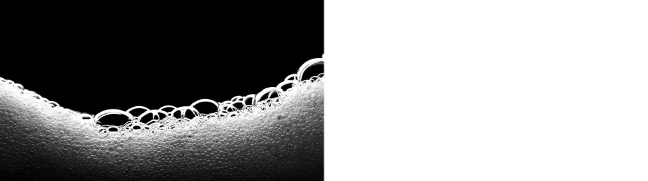White soap foam wave on black and transparent background. Isolated suds and bubbles border design element. Cosmetic or cleaning product concept