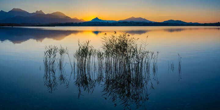 Germany, East Allgaeu, near Fuessen, Lake Hopfensee at sunset