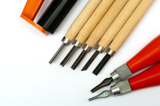Art and crafts - linocut tools on white paper