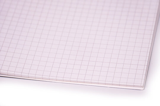 Close-up of grid notebook, top-down view, light gray lines on white paper, smooth texture, subtle shadows, clean minimalistic style, high-quality finish, even soft lighting, distraction-free