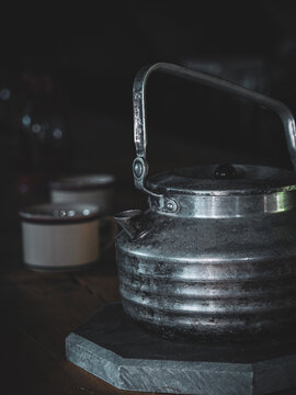 Ribbed Vintage Metal Kettle on Stone Trivet