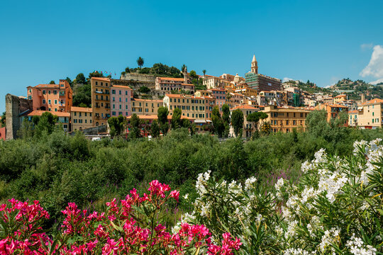 View of the old town of Ventimiglia, Italy under a blue sky.