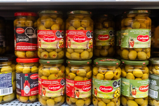 Villa de Alvarez, Colima. Mexico. June 26, 2026: Carbonell Green Olive Jars Displayed on Supermarket Shelf for Retail Grocery Shopping