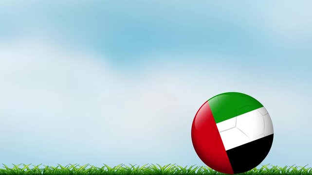 Bouncing Football with United Arab Emirates Flag Pattern on Grass