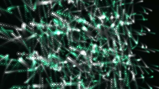Glowing emerald green and silver particles moving in circular patterns across a dark energy field