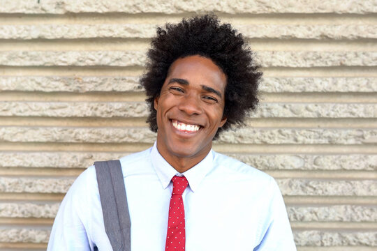 Approachable teacher on campus. Bright outdoor shot of friendly college staff member