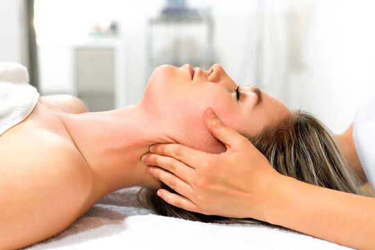 Relaxing neck massage in bright wellness studio