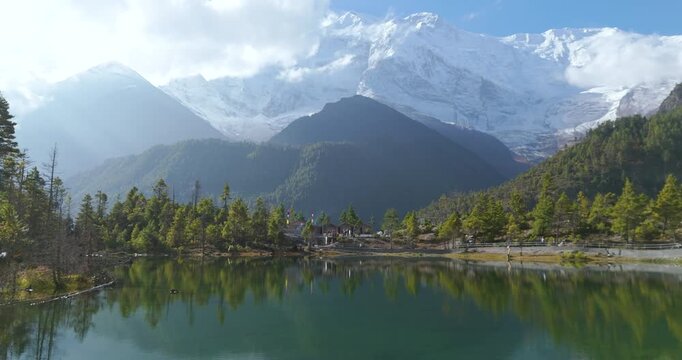 Annapurna Circuit, Manang, Nepal, aerial drone shot over the pristine Green Lake on the Annapurna Circuit route with reflections of the snowy Annapurna II range