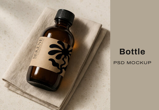 Elegant Amber Bottle Mockup On Linen Cloth With Shadow Play PSD