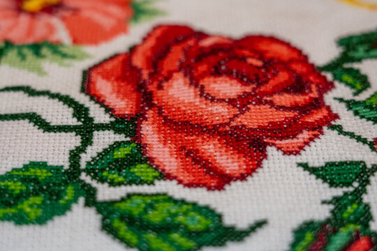 Handmade. Cross-stitched red rose.