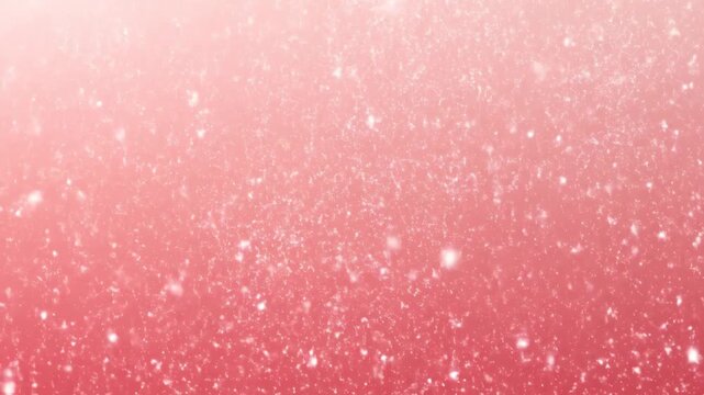 Abstract shimmering white dust particles floating against a soft pink and coral color gradient background loop, providing a magical and ethereal visual effect.
