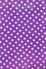 Grunge purple and white polka dot pattern background © Karen Roach