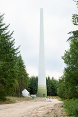 Fototapeta premium Expansion of renewable sustainable energy, building new wind turbine park, technology, environment and ecosystem in Germany, deforestation of forest