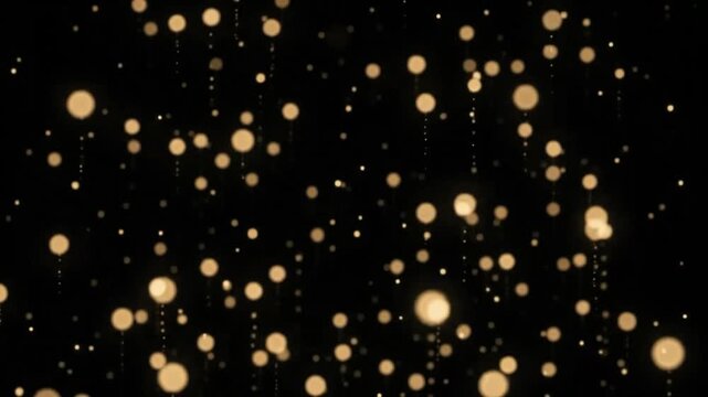 Soft golden bokeh light particles slowly float upward against a solid black background.