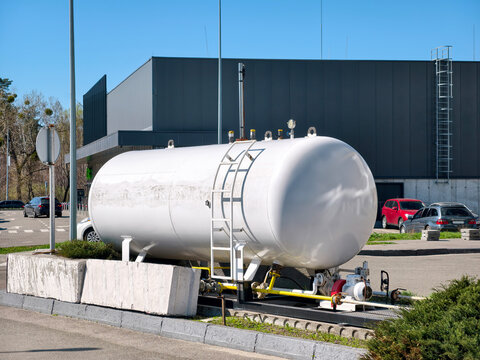 Gas storage tank with regulator and safety equipment at modern fueling station