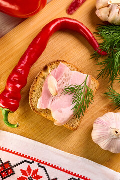 Traditional Ukrainian Feast Composition with Salo and Vegetables