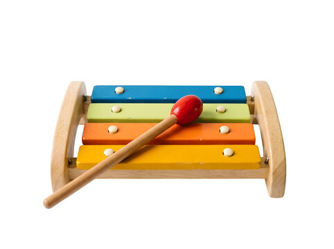 A colorful wooden toy xylophone with a mallet isolated on transparent background