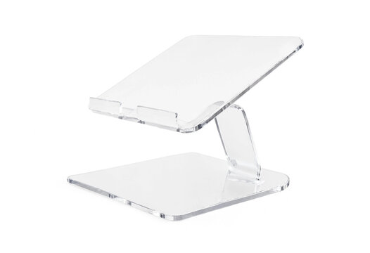 Transparent acrylic tablet or smartphone holder stand isolated on white background