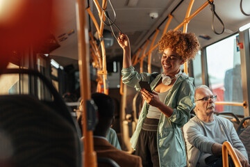 Young woman enjoying bus ride using smartphone © bernardbodo