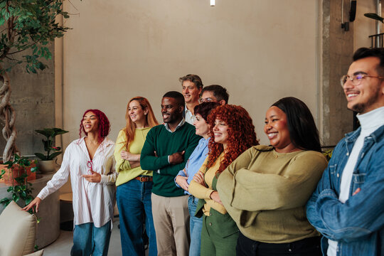 Diverse business team smiling at an informal meeting